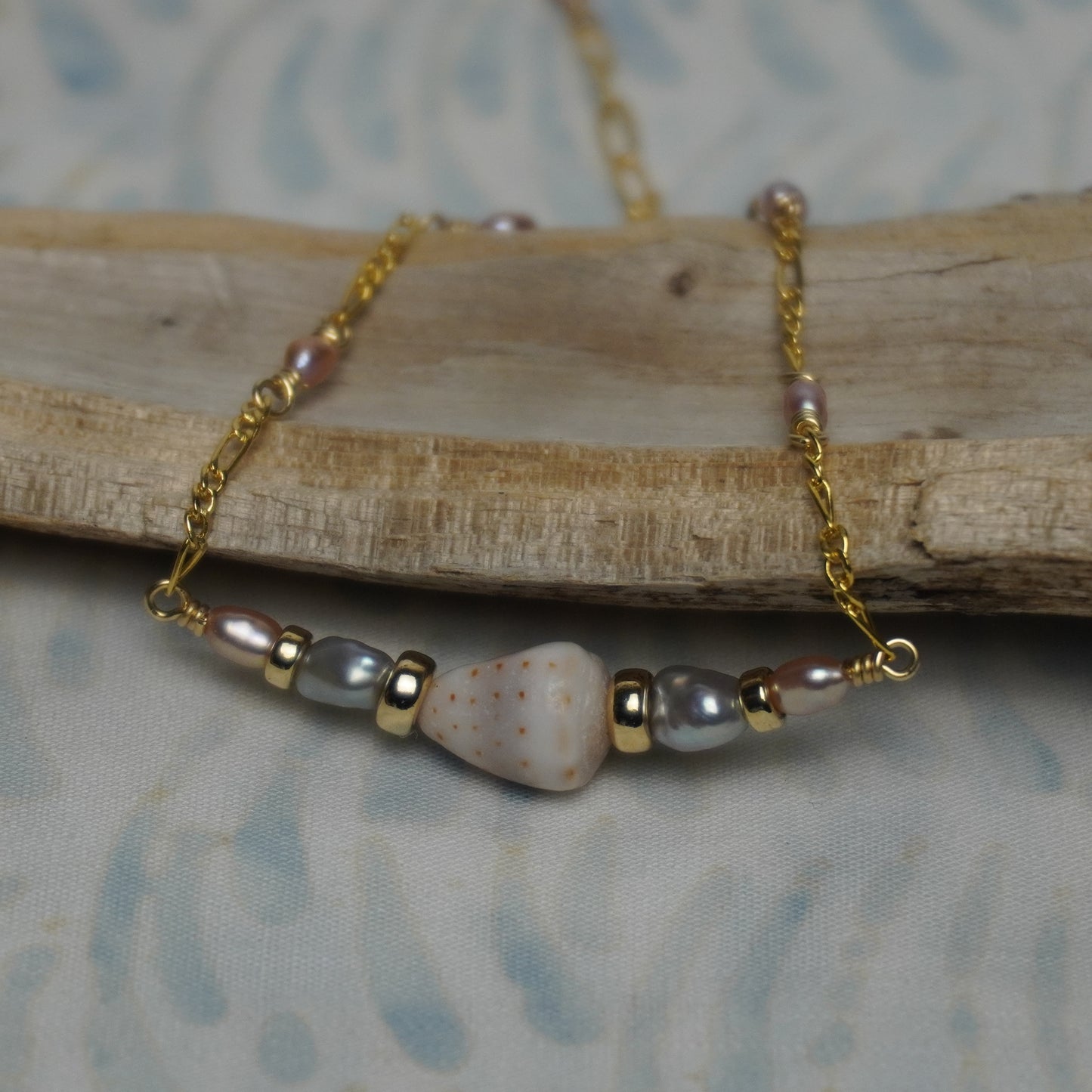 Grey and White Freshwater Pearl Bracelet with Mini Cone Shell