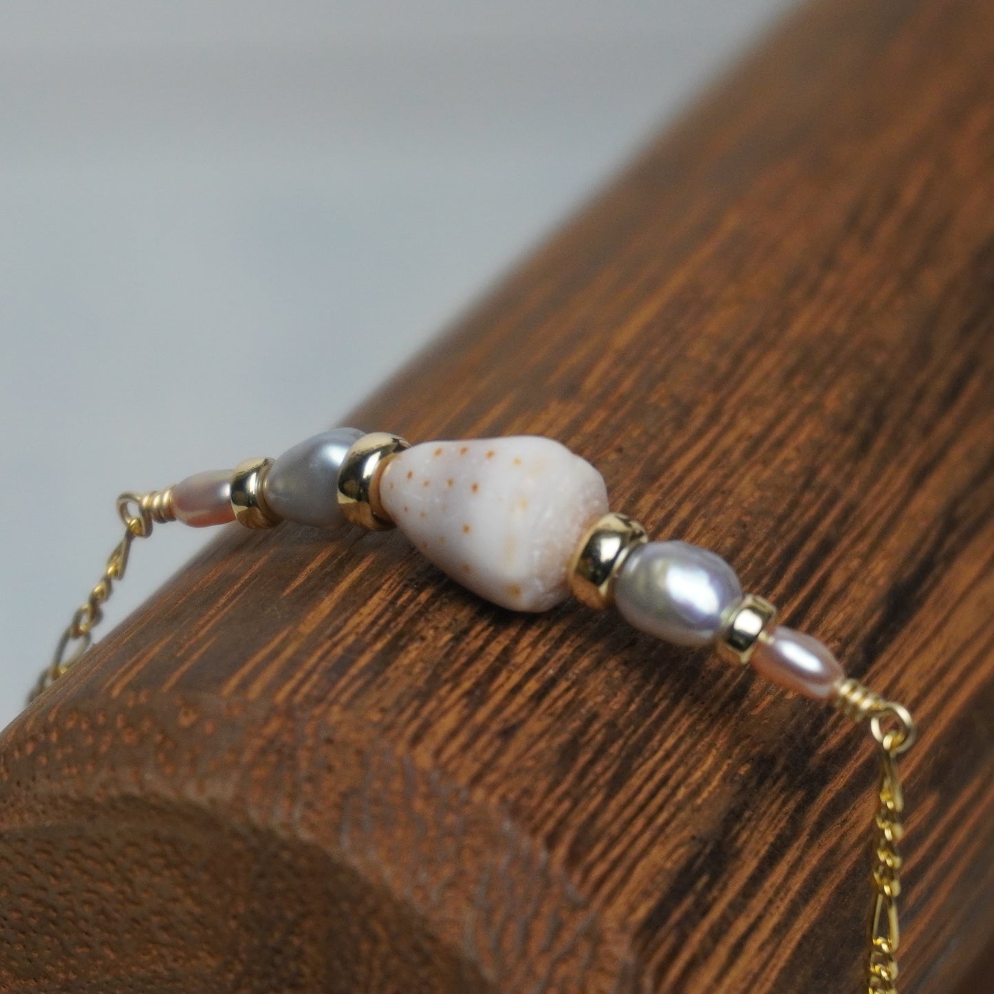 Grey and White Freshwater Pearl Bracelet with Mini Cone Shell
