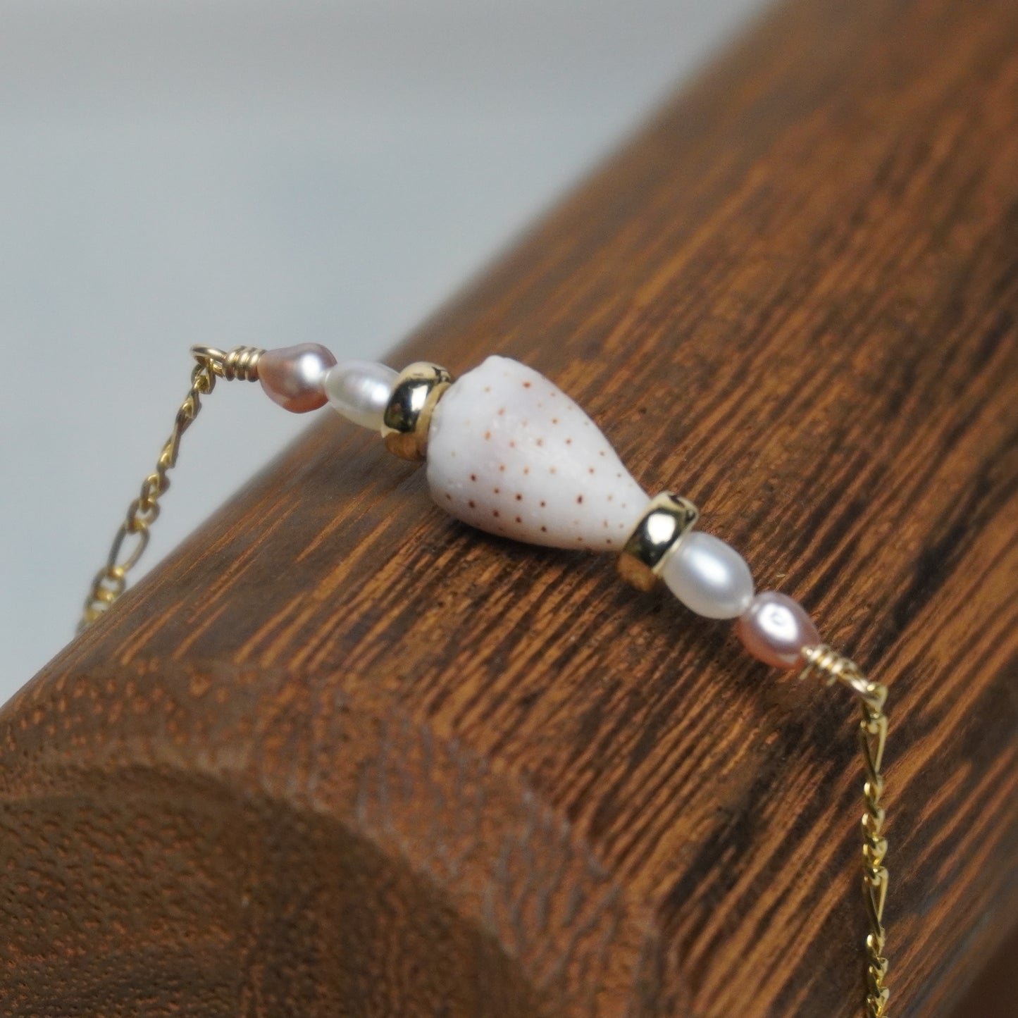 Pink & White Freshwater Pearl Bracelet with Cone Shell on Figaro Chain